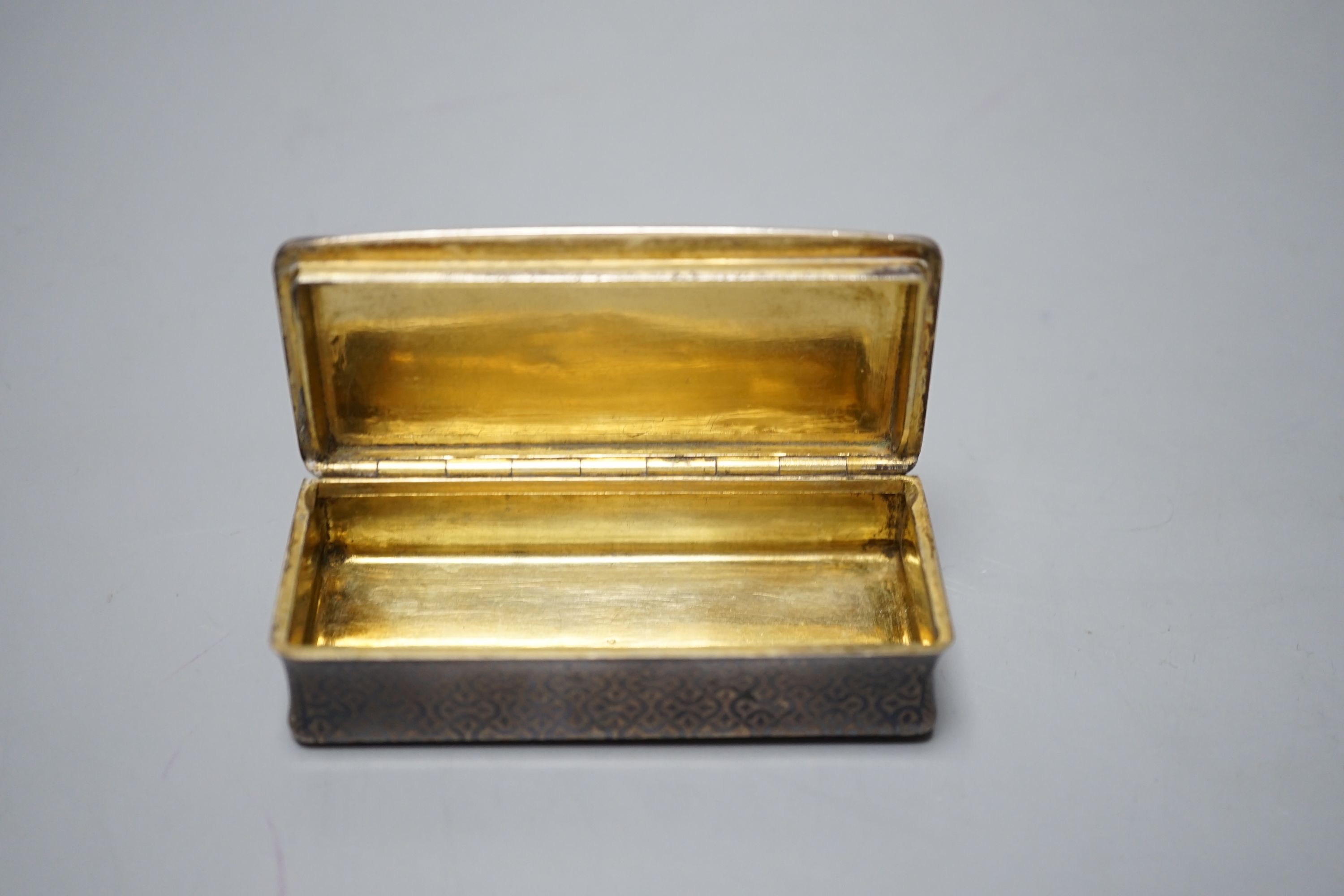 A 19th century French white metal and niello snuff box, decorated with hunting scene, 78mm.